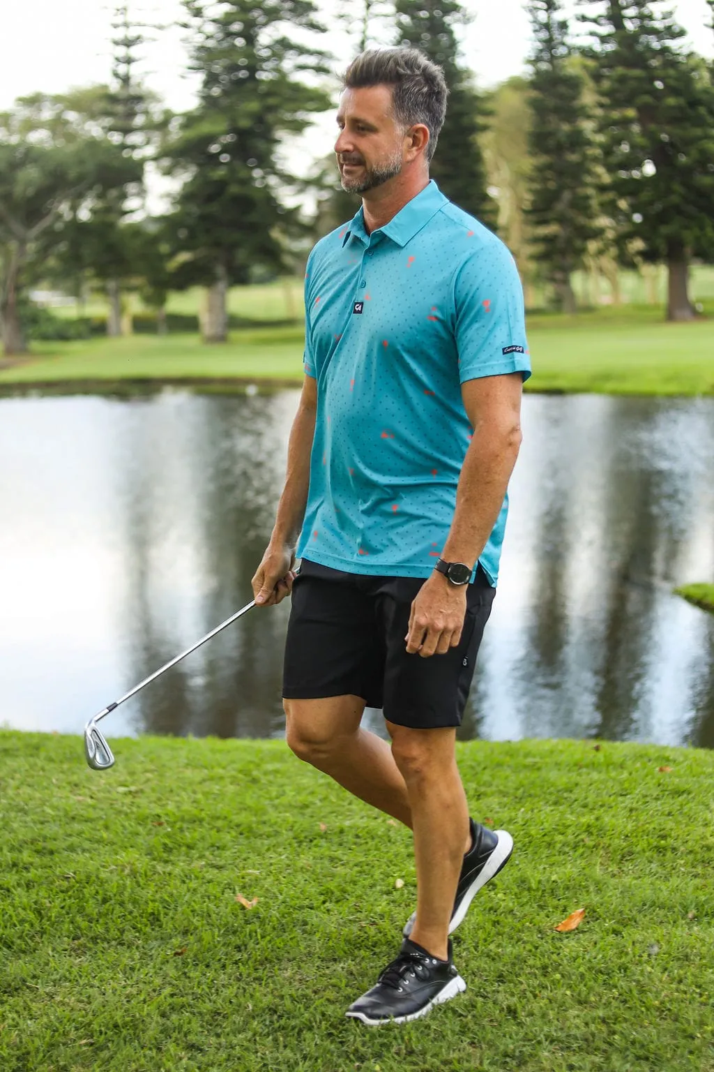 CA Statement Golf Shirt | Teal & Orange