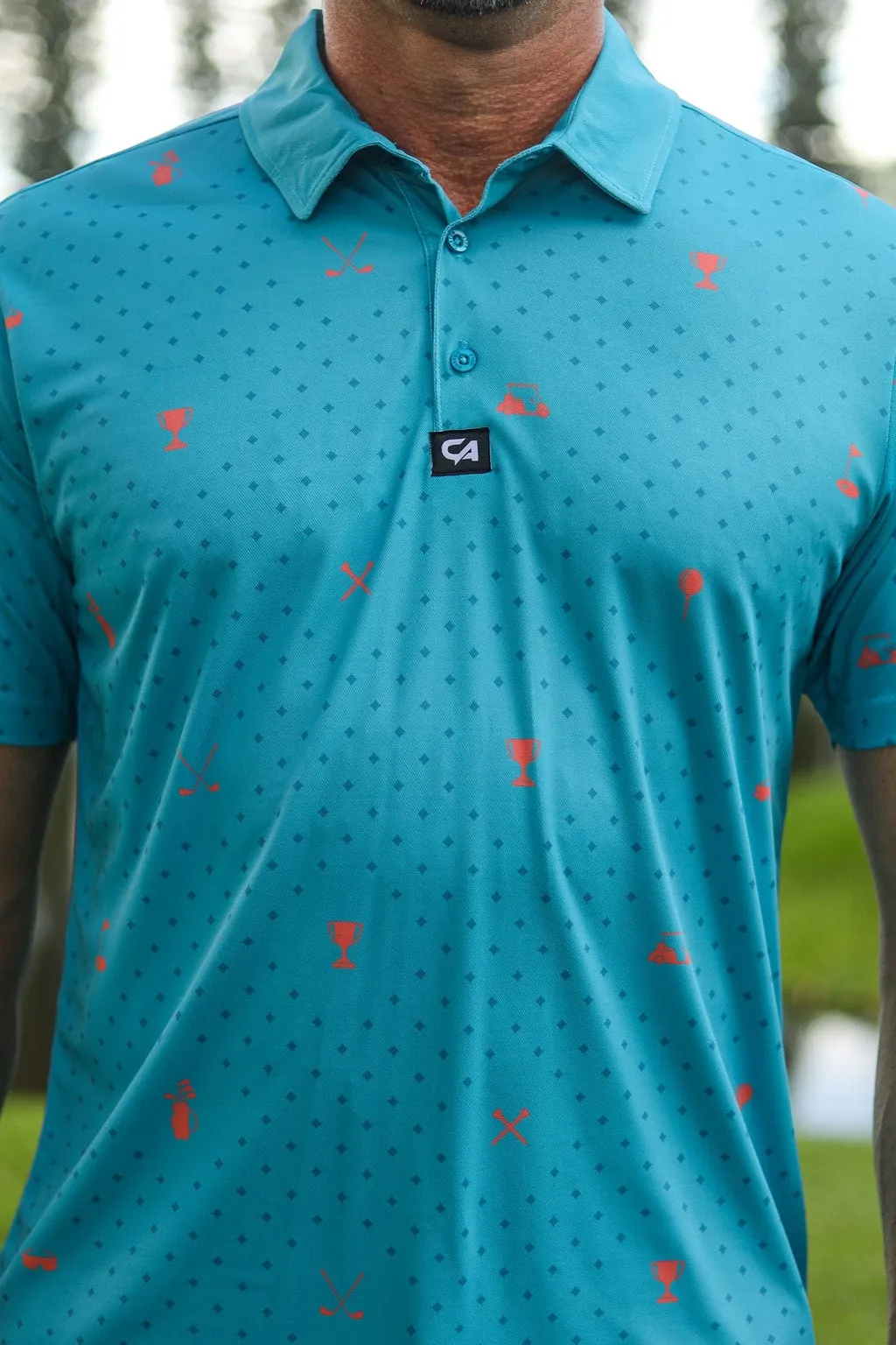 CA Statement Golf Shirt | Teal & Orange