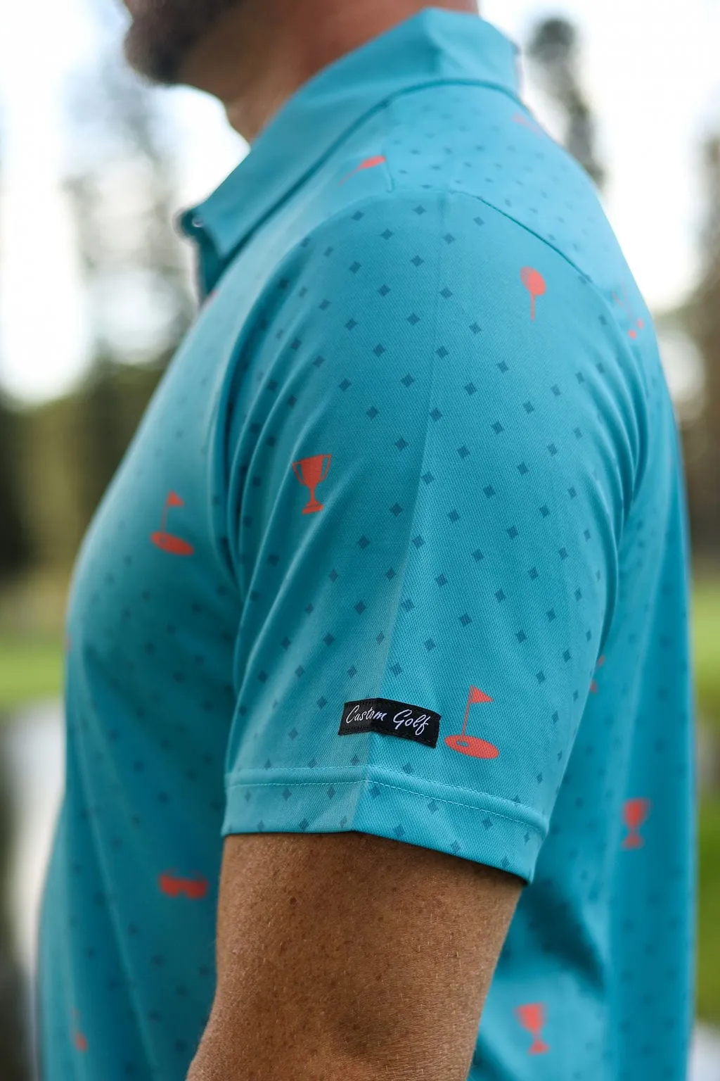 CA Statement Golf Shirt | Teal & Orange